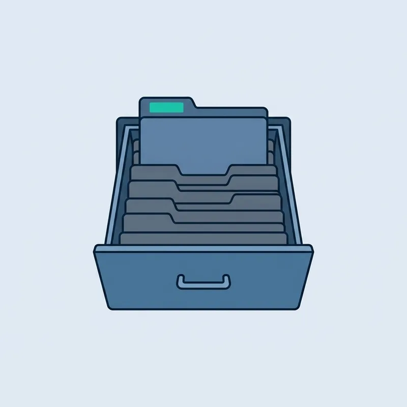 An open metal filing drawer with a row of dividers and one folder standing proud