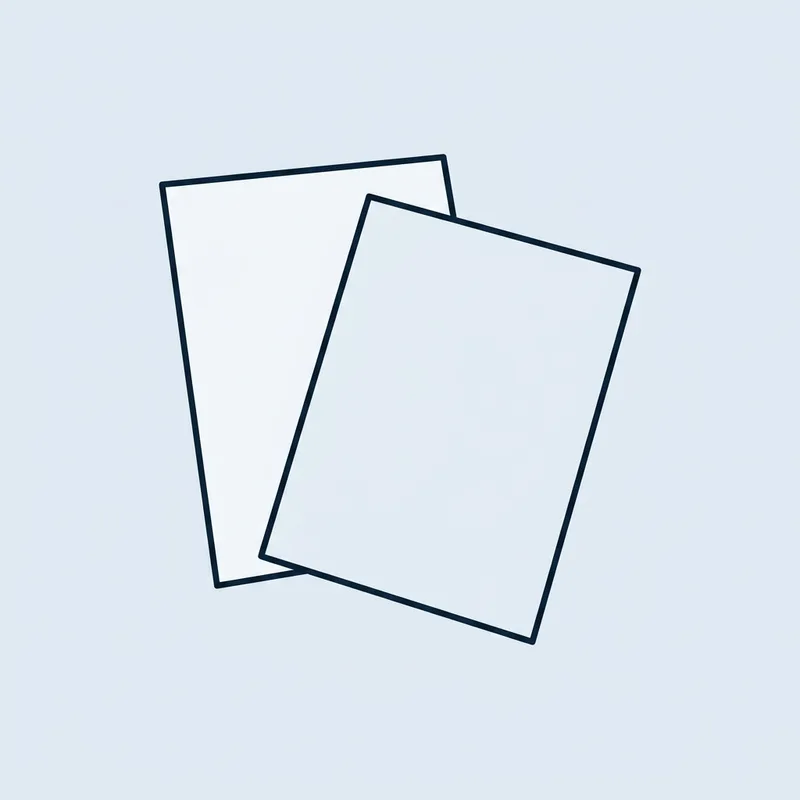 Two overlapping paper documents on a plain surface, one partly covering the other